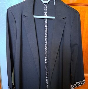 Have Black Blazer with Notched Lapel and Smooth Finish